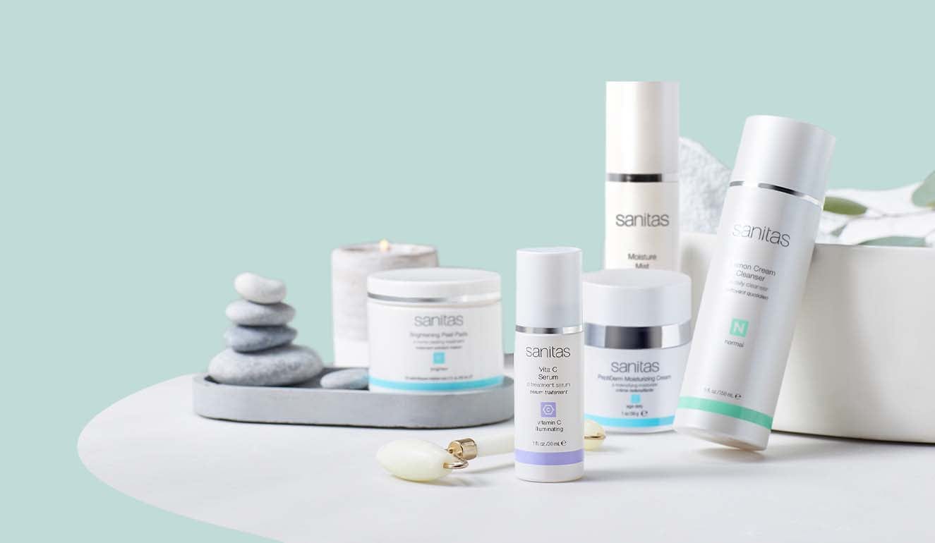 Collection of skincare products on a light blue background