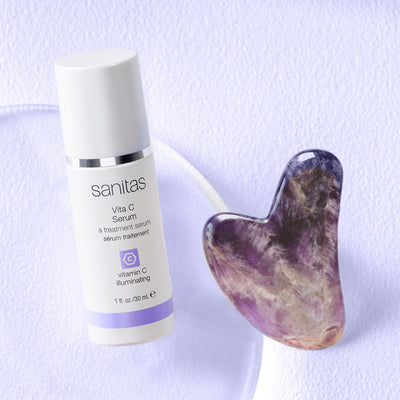 vita c serum next to gua sha stone
