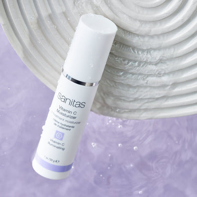 vitamin c moisturizer with white plate in water