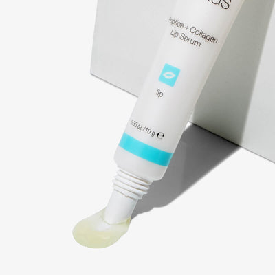 Peptide + Collagen Lip Serum product tilted showing the serum coming out of product tube
