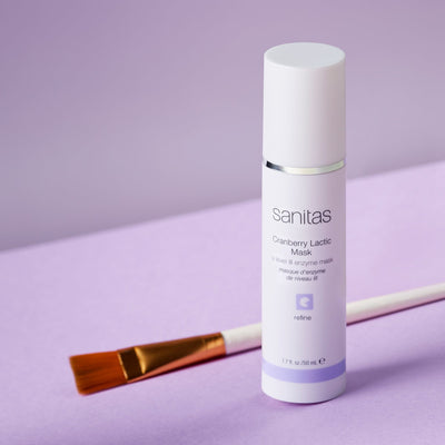 cranberry lactic mask next to face brush